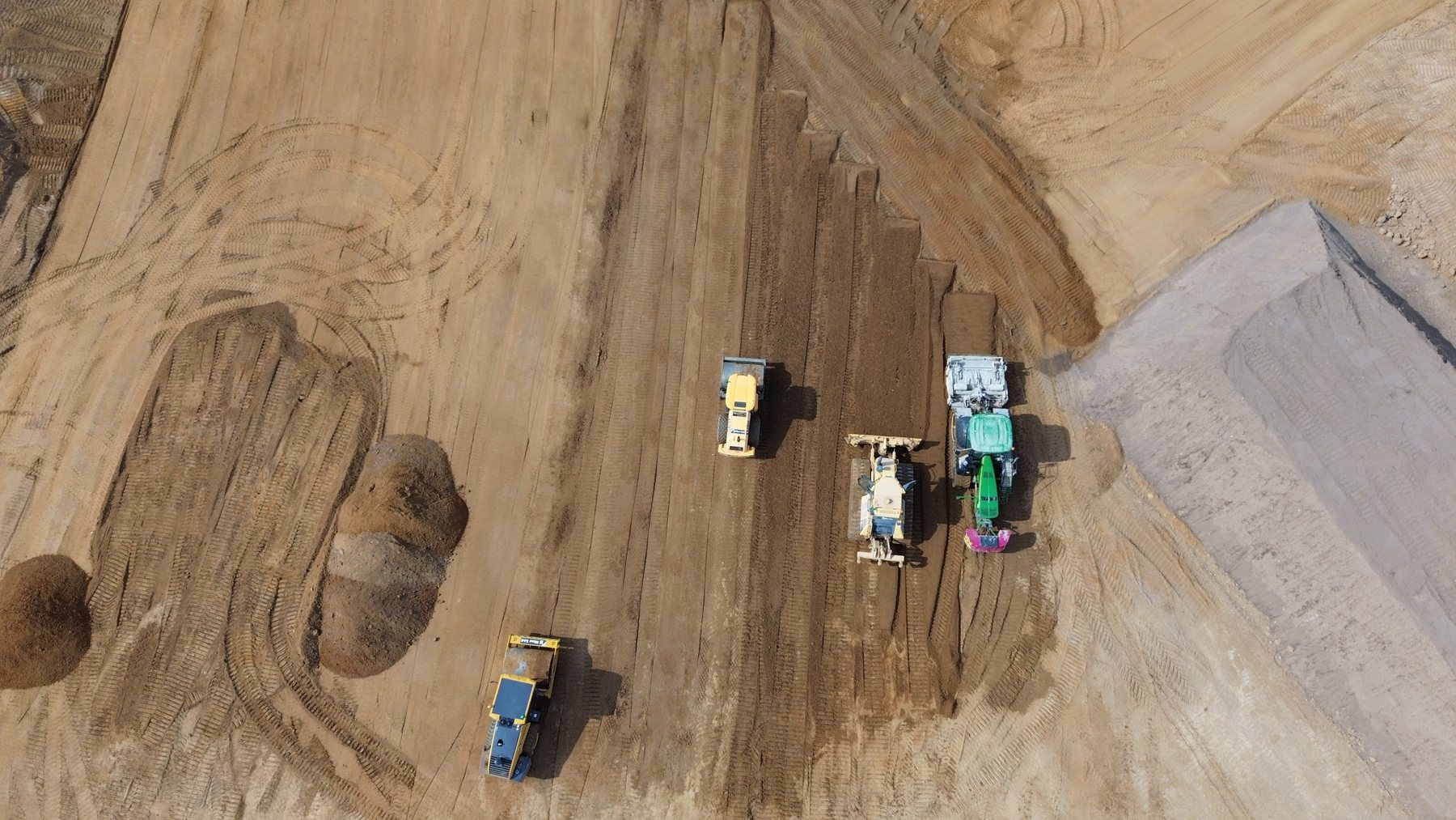 Aerial view of controlled material placement during earthworks