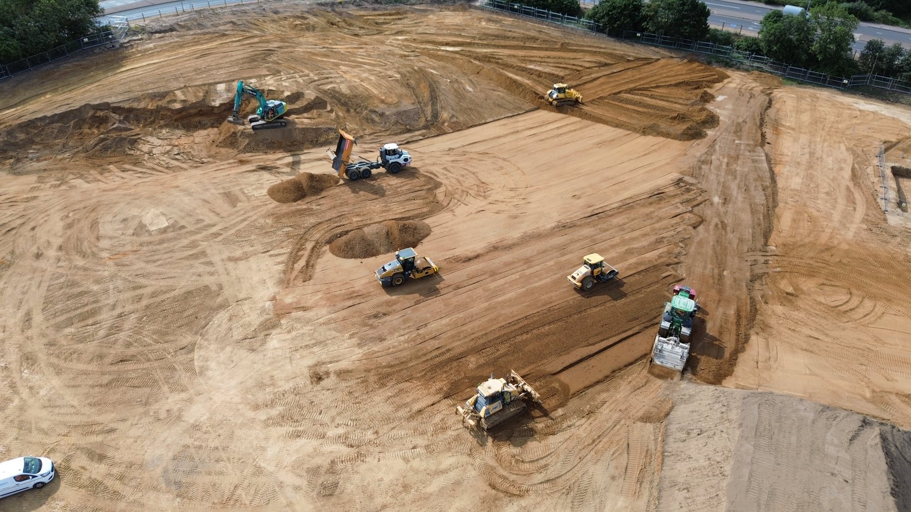 Earthmoving plant operating across a JJMac construction site