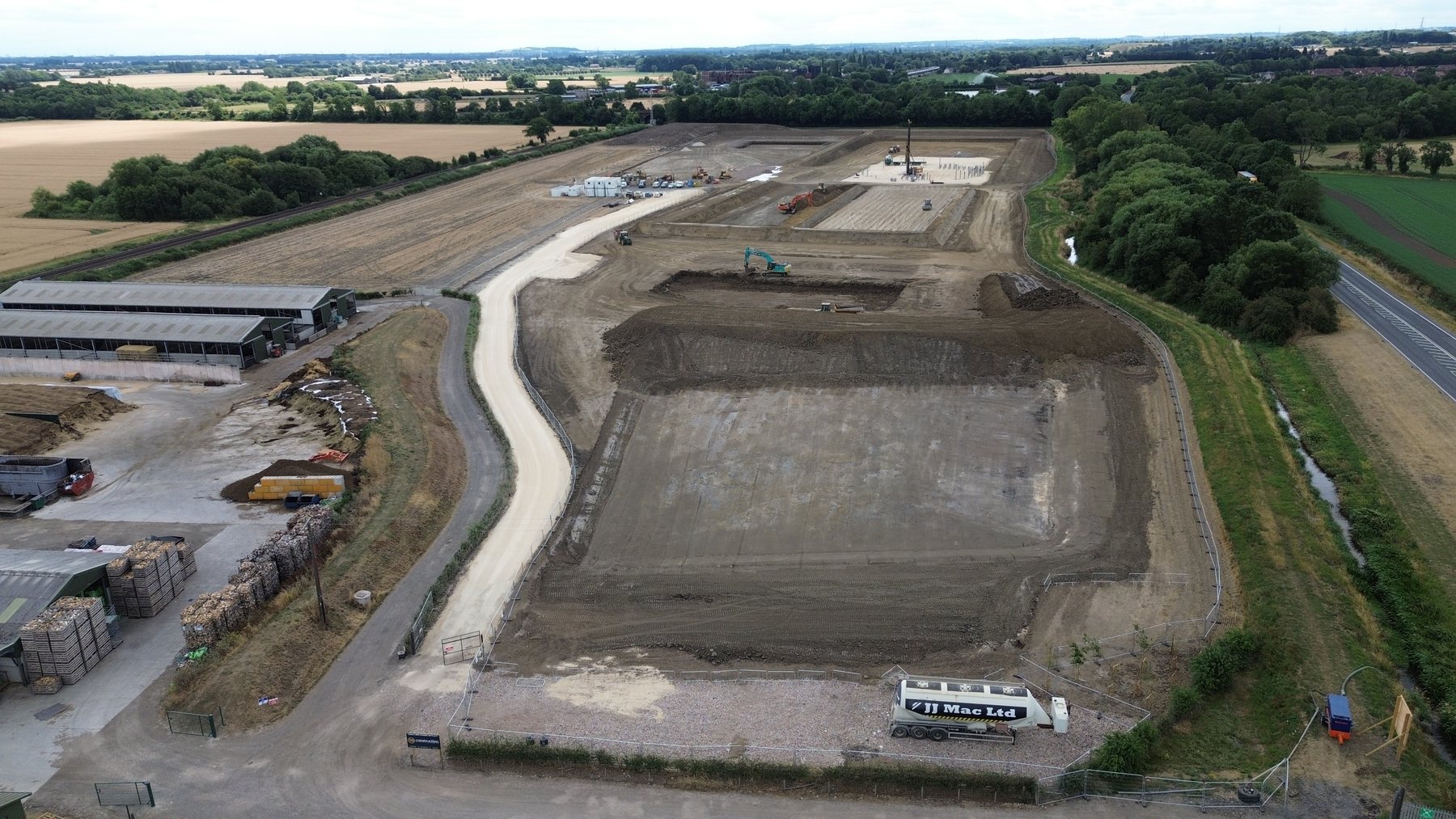 Aerial view of a large JJMac earthworks project and prepared site platforms
