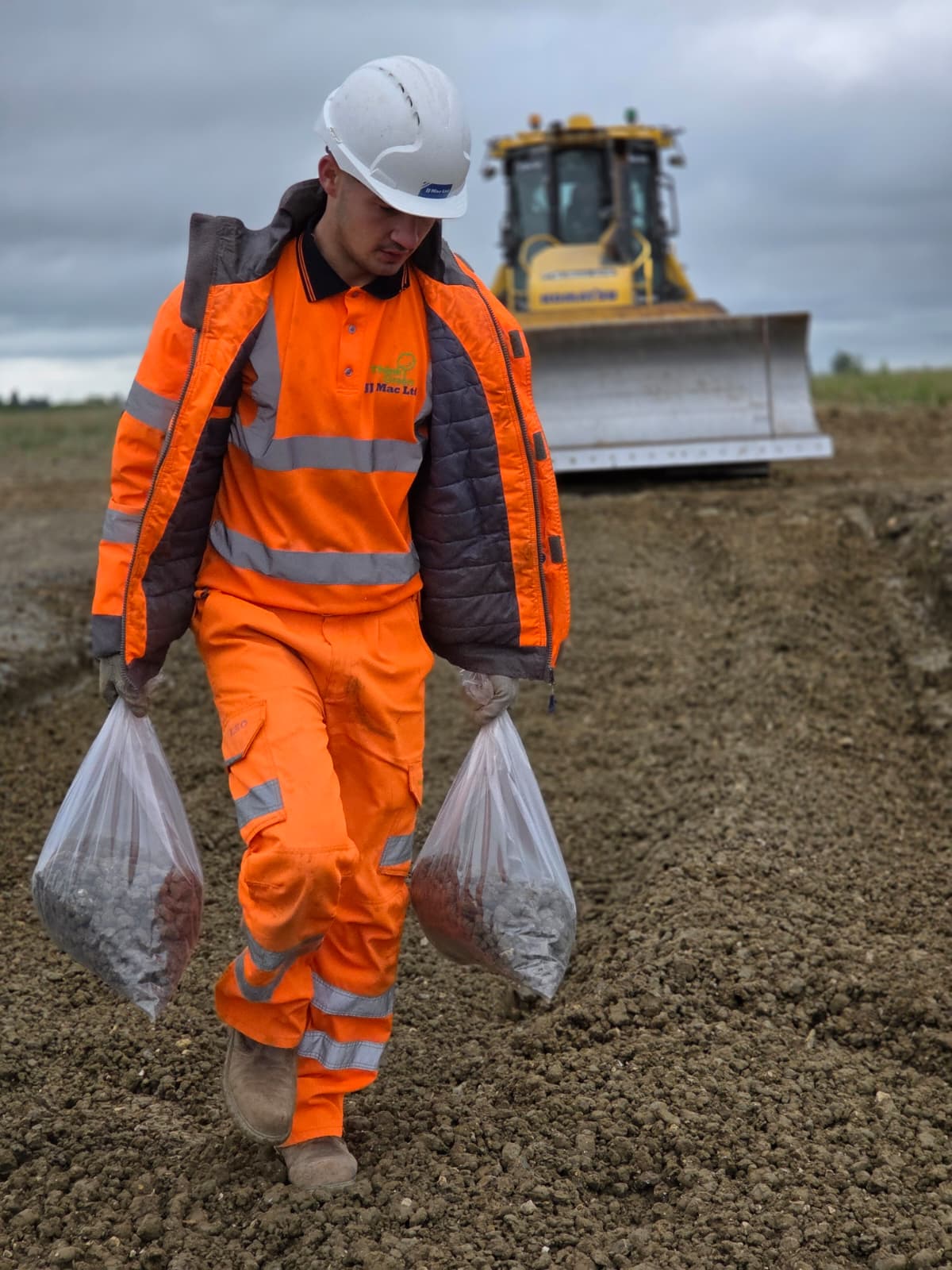 JJMac technician collecting ground samples on site