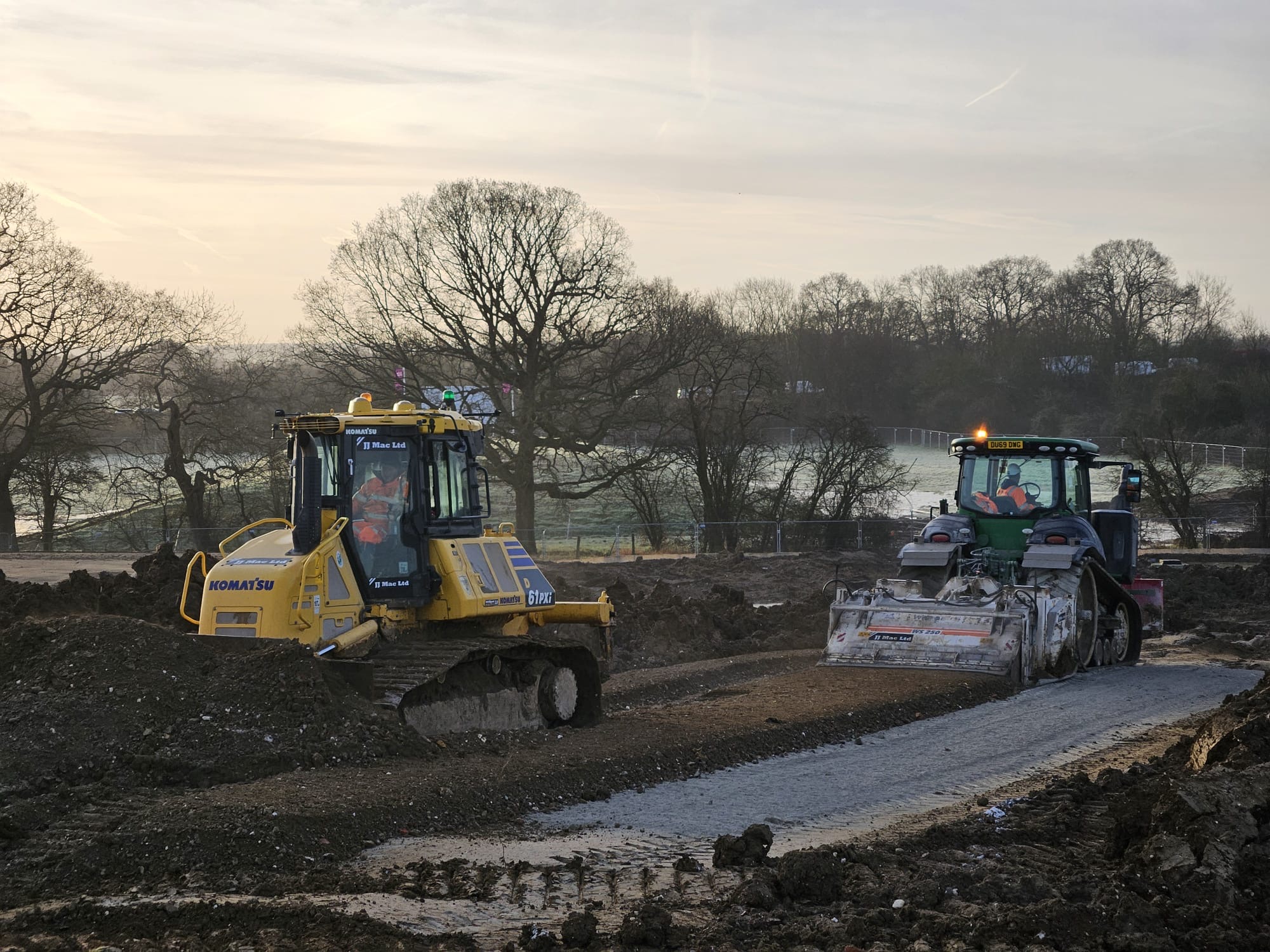 JJMac plant mixing and grading treated ground